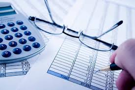 calculator, glasses, paper